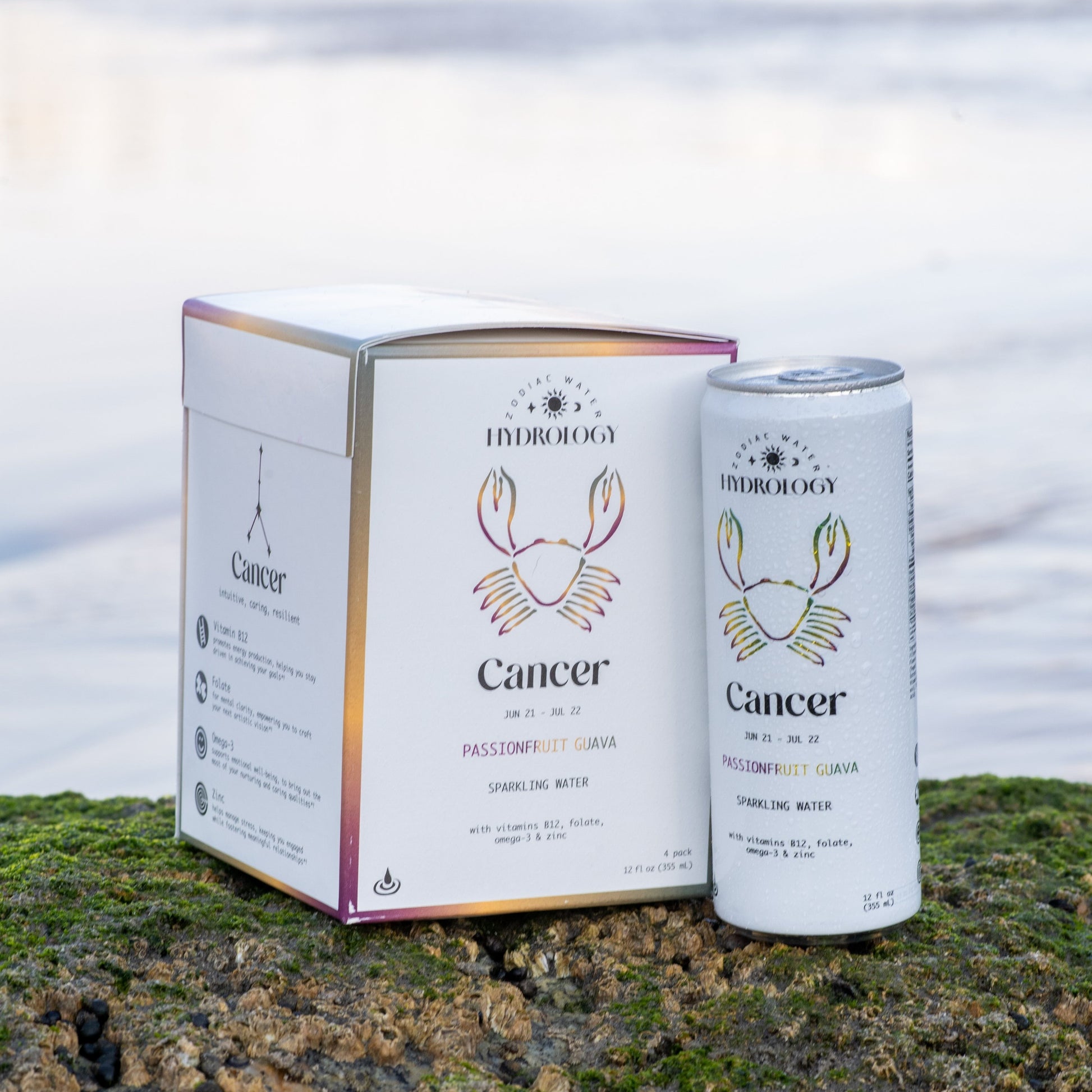 Cancer astrology themed beverage 4-pack and can on rock at beach