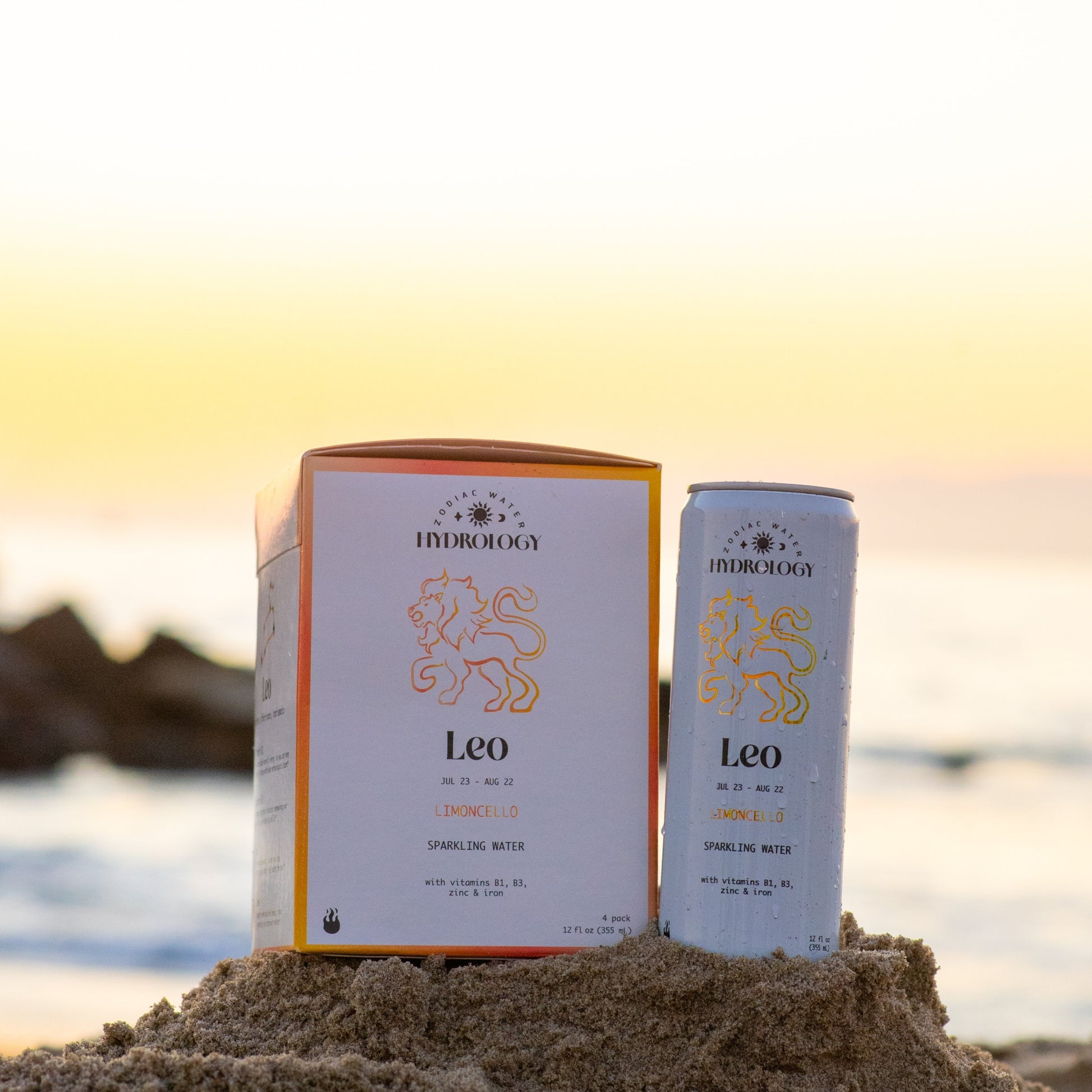 Leo astrology themed beverage 4-pack and can in sand at beach